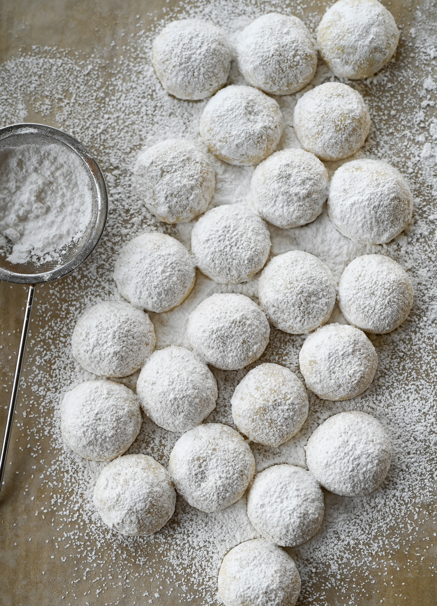 dusting snowball cookies with flour
