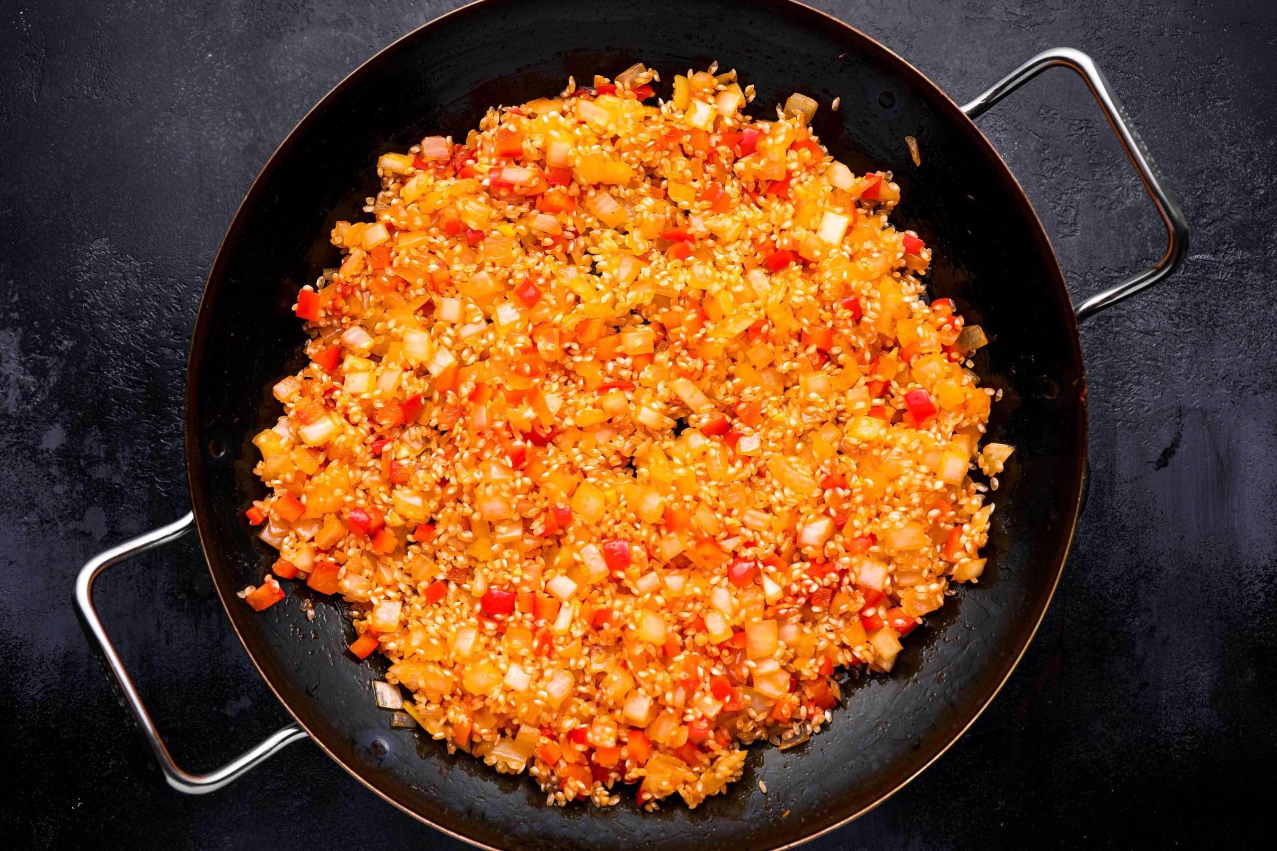 Rice and vegetable mixture in a pan.