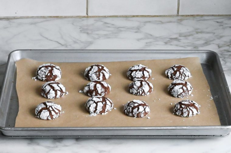 baked chocolate crinkle cookies on cooling rack