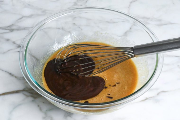 whisking in the melted chocolate mixture