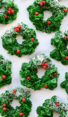 christmas wreath cookies on marble board.