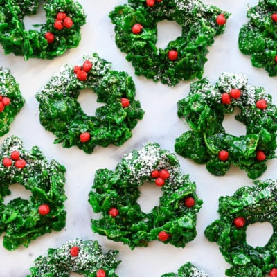 Christmas wreath cookies on marble board.