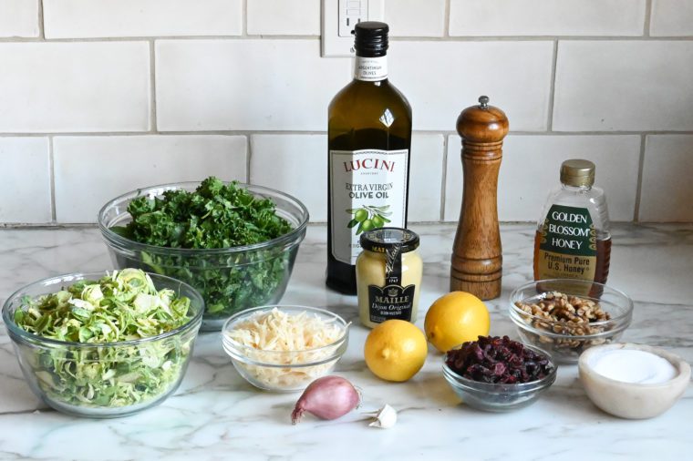 Salad ingredients including lemon, olive oil, and honey.
