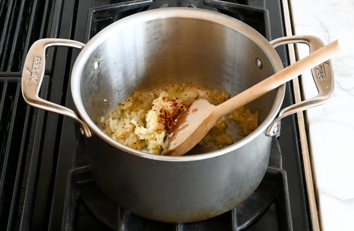 adding garlic and red pepper flakes