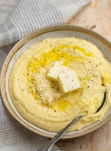 creamy polenta with butter in bowl.