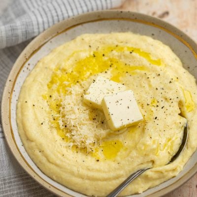 creamy polenta with butter in bowl.