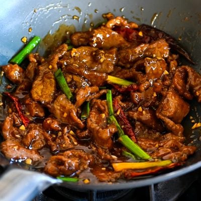 Mongolian beef in a wok.