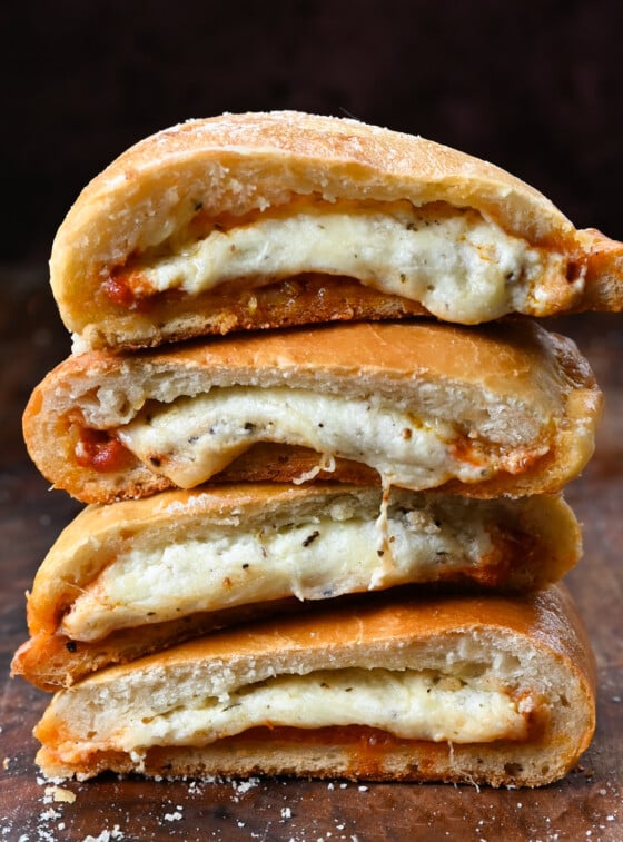 Stack of halved Calzones.