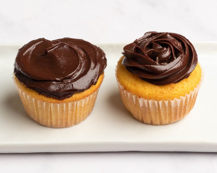 Cupcakes topped with chocolate ganache.