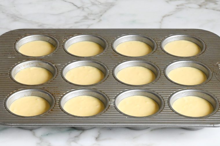 egg bite batter in greased muffin tin