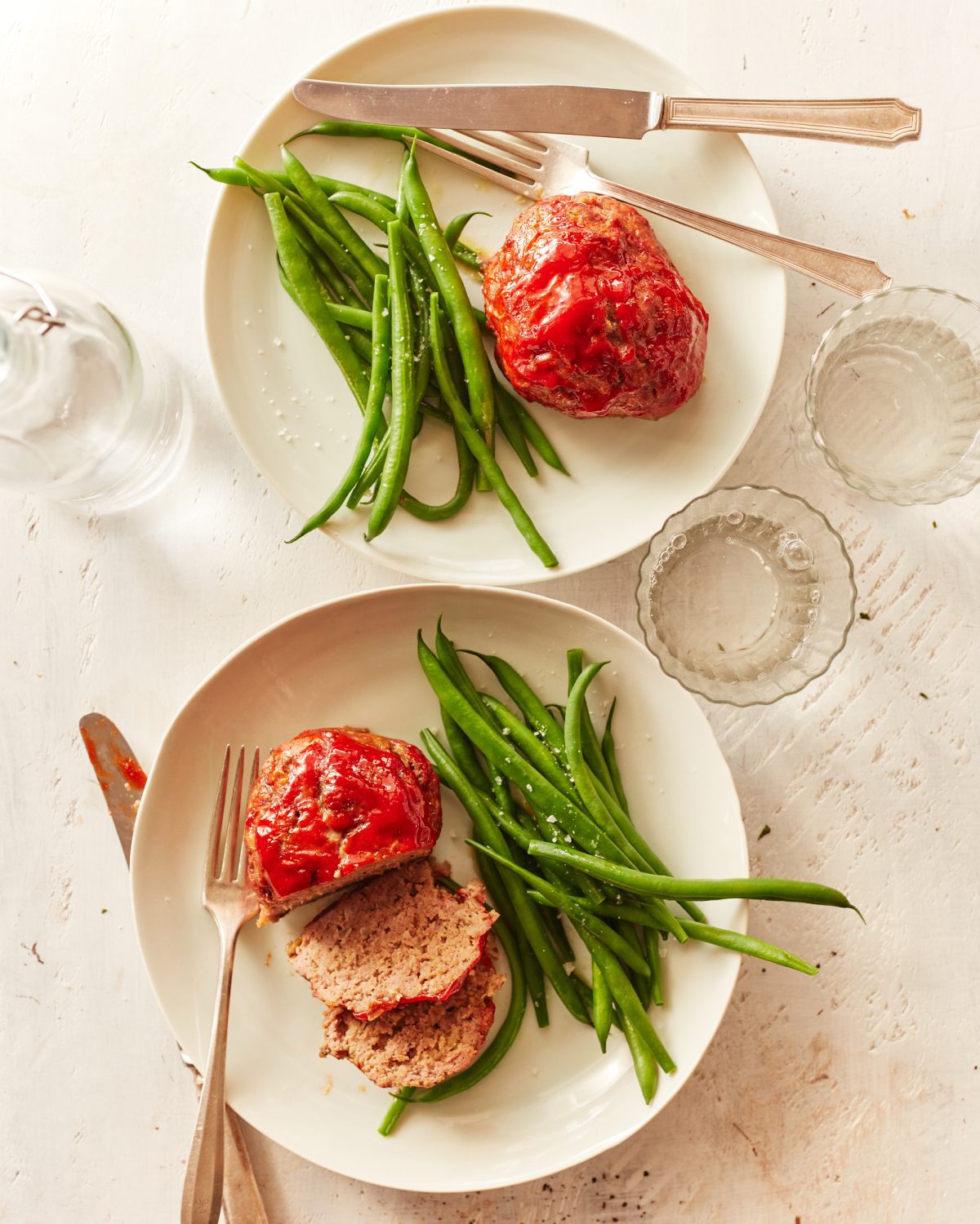 individual meatloaf servings on plates
