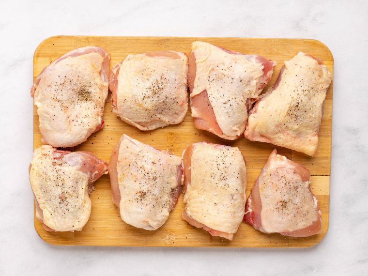 seasoning chicken thighs with salt and pepper