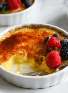 Spoon in a partially-eaten creme brulee.