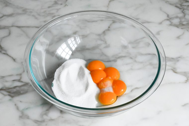 egg yolks, sugar, and salt in bowl