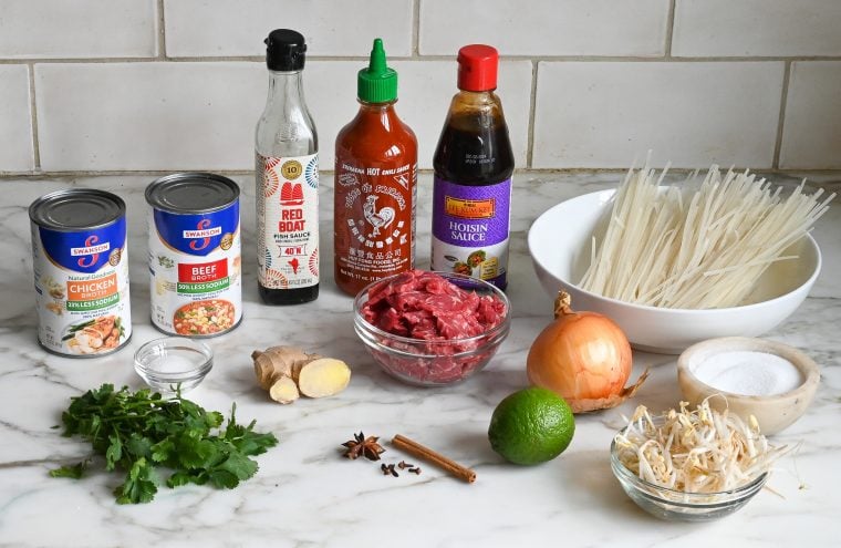 Pho ingredients including sriracha, hoisin sauce, and fish sauce.