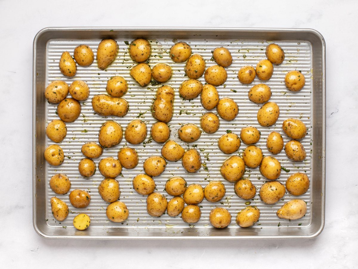 potatoes arranged cut side down on baking sheet