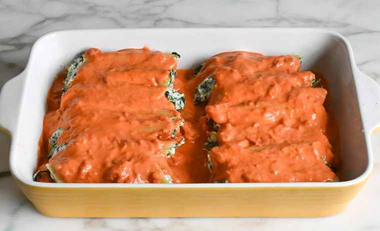 spinach manicotti covered with sauce