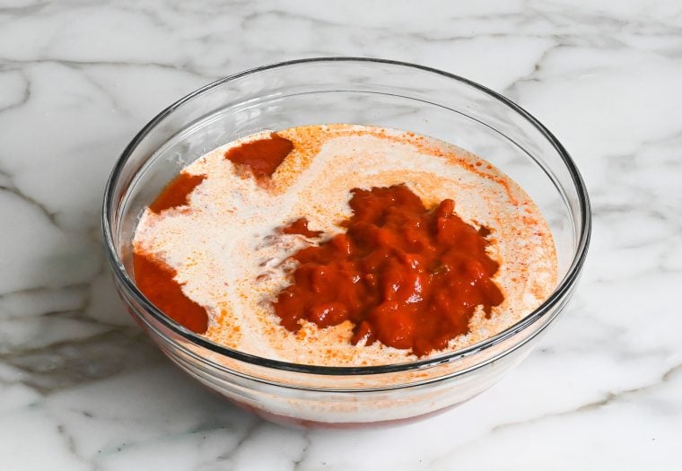 marinara sauce and heavy cream in bowl