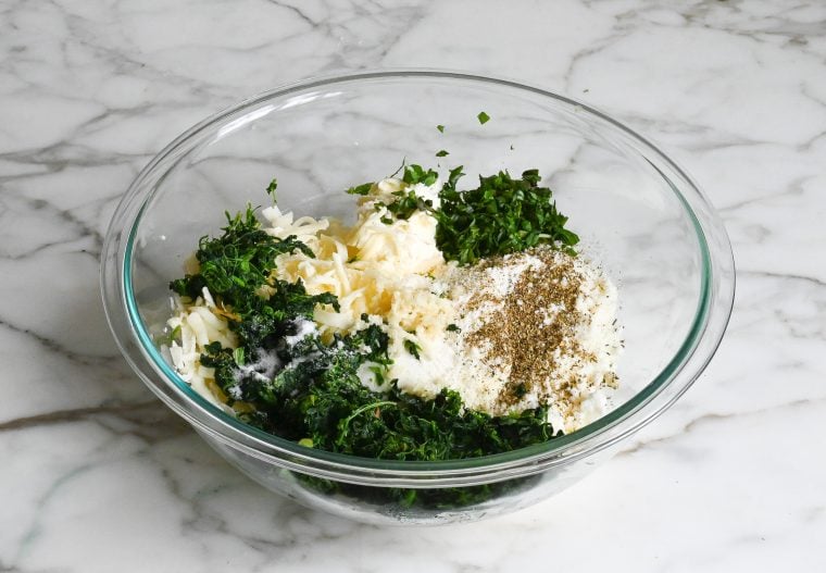 remaining filling ingredients added to bowl with eggs