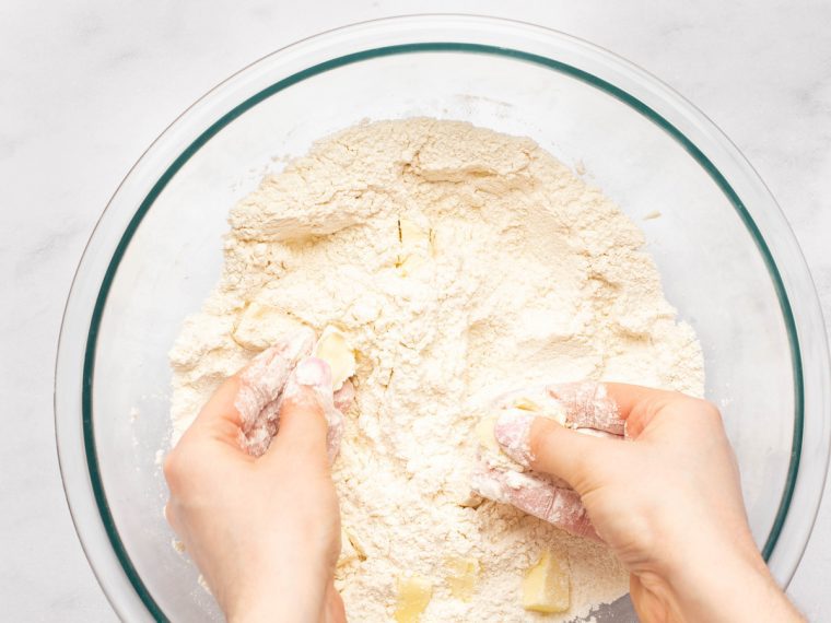 cutting the butter into the dry ingredients