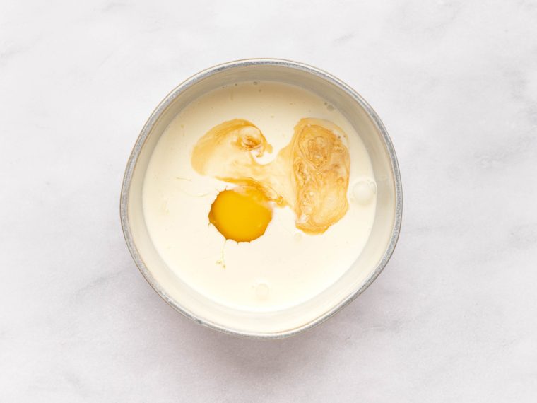 egg, vanilla, and heavy cream in mixing bowl