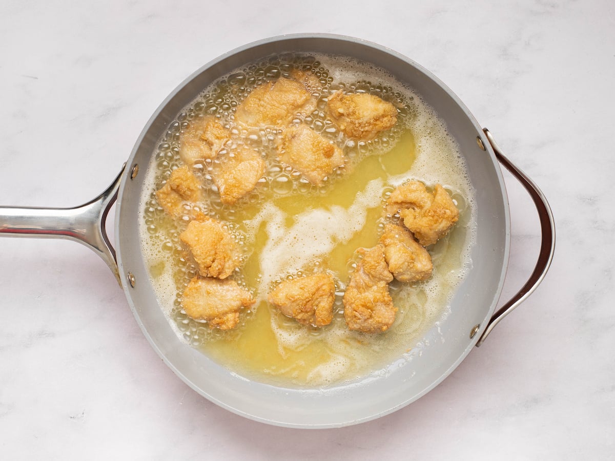 frying the chicken on the second side