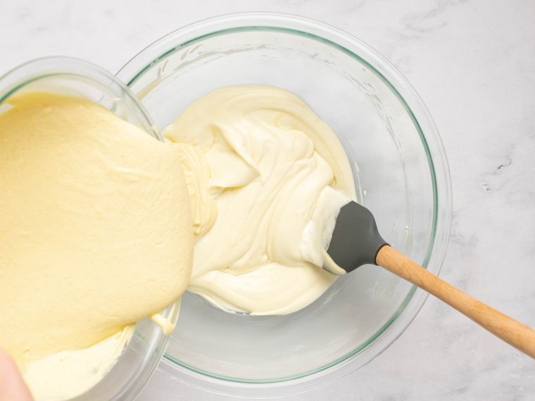 Adding the remaining egg-mascarpone mixture into the whipped cream