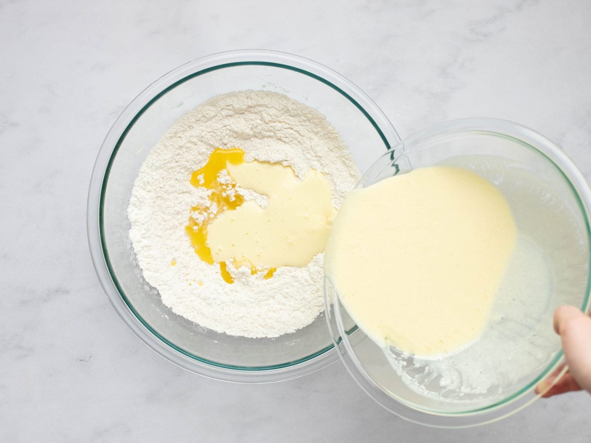 adding the buttermilk mixture and melted butter to the dry ingredients.
