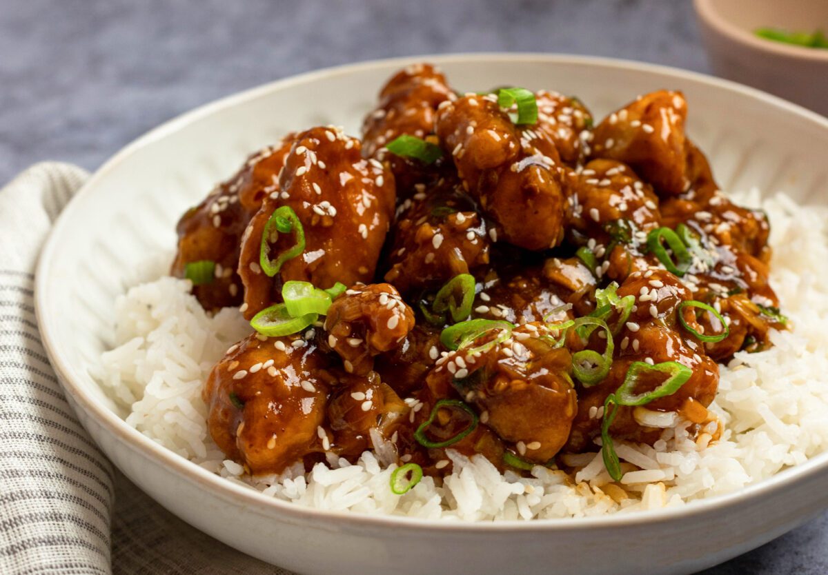 General Tso's chicken in bowl over rice.