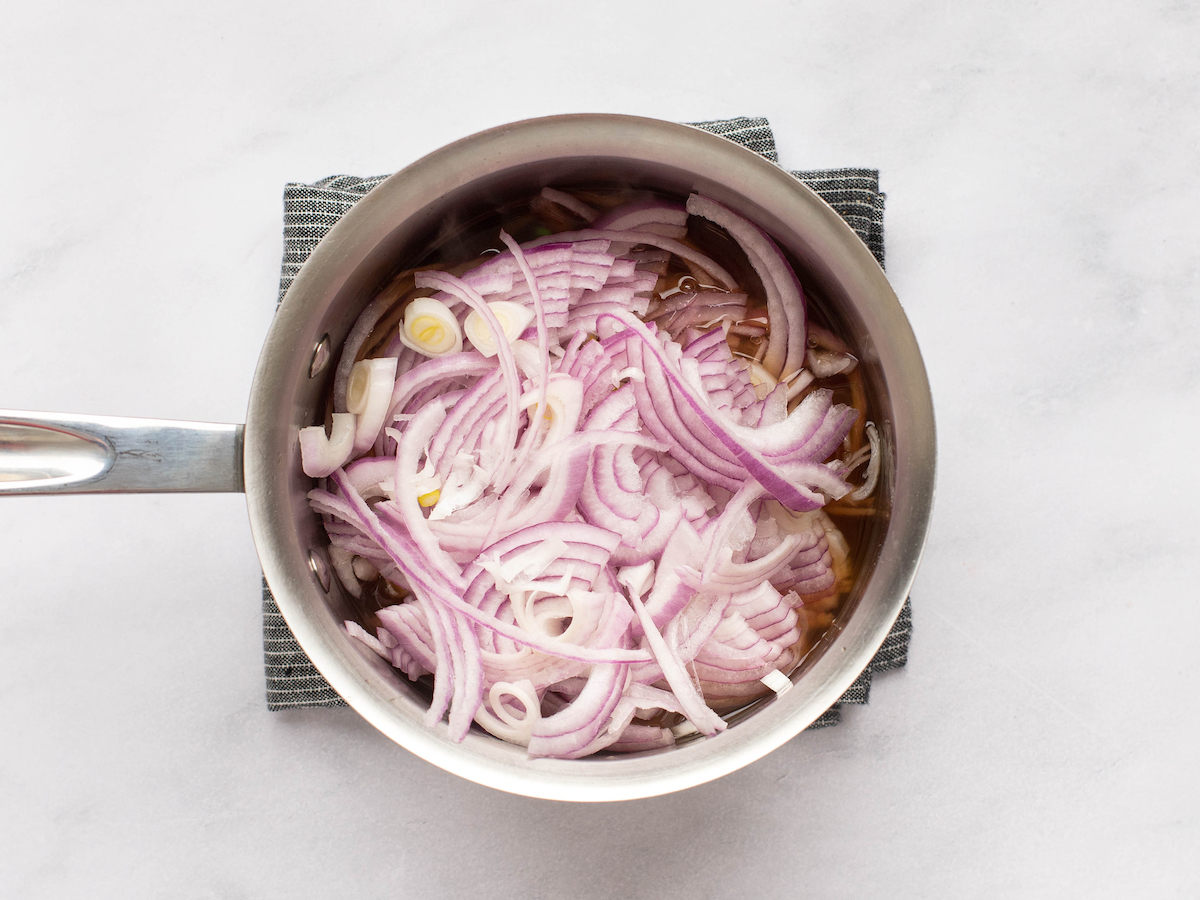 adding onions to the pan