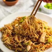 chicken chow mein on plate with chopsticks