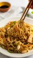 chicken chow mein on plate with chopsticks
