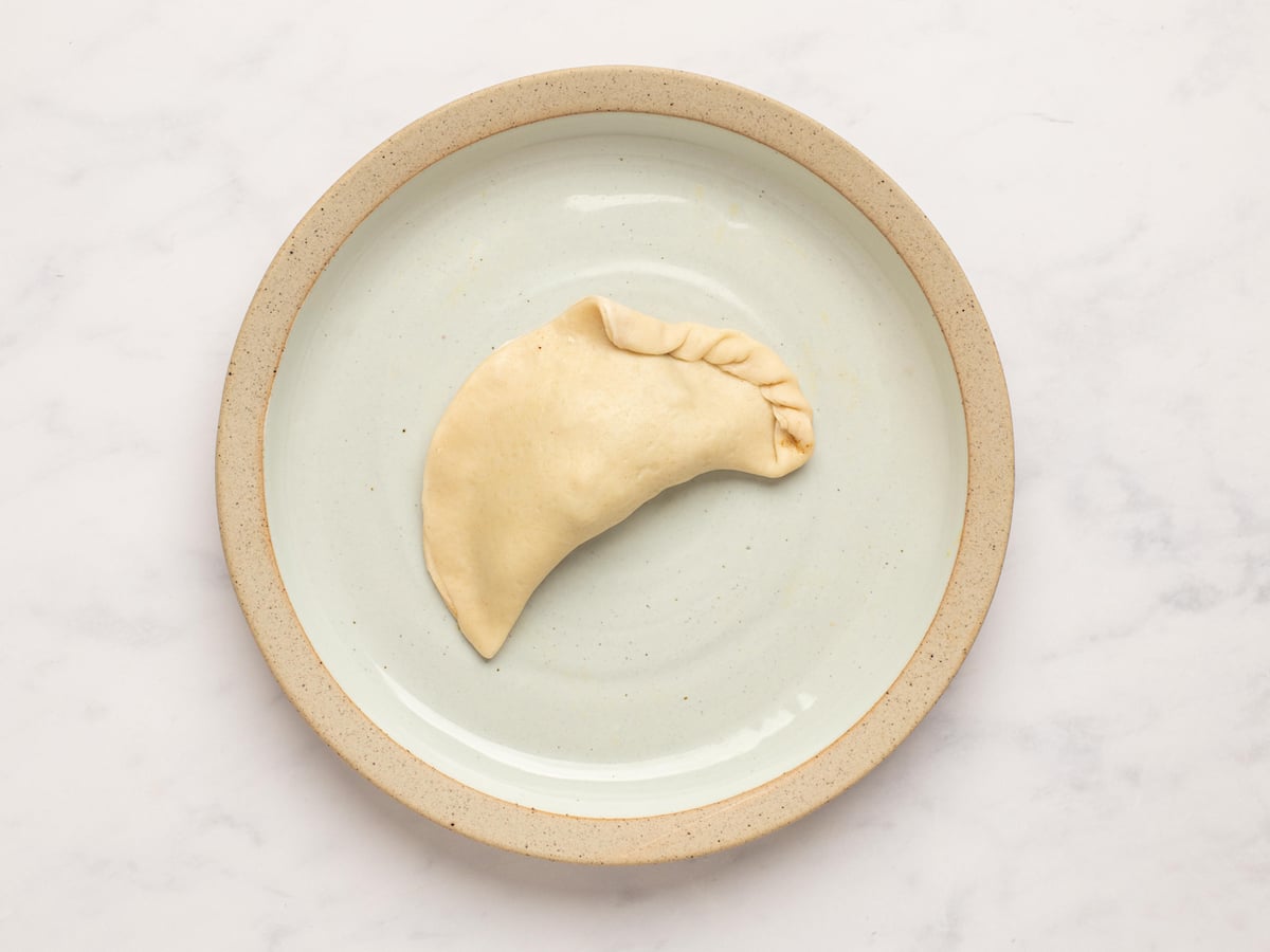 pinching and twisting pastry into rope-like shape