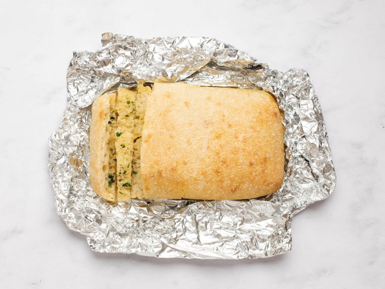baked garlic bread on foil