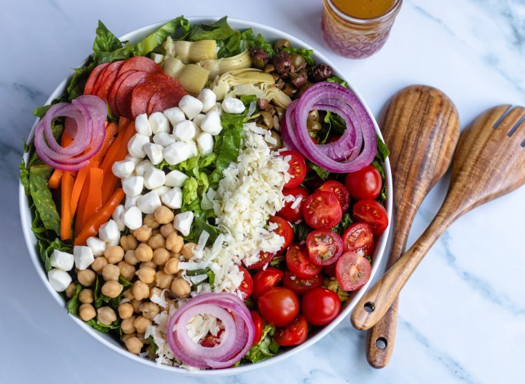 antipasto salad ingredients in large bowl