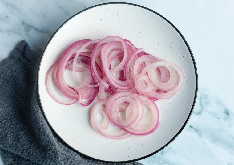 pickled red onions on plate