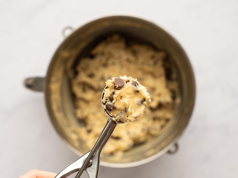 scooping dough into firmly packed 1.5-tablespoon balls