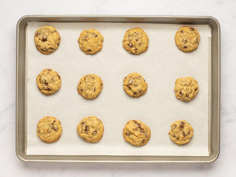 baked oatmeal chocolate chip cookies on baking sheet