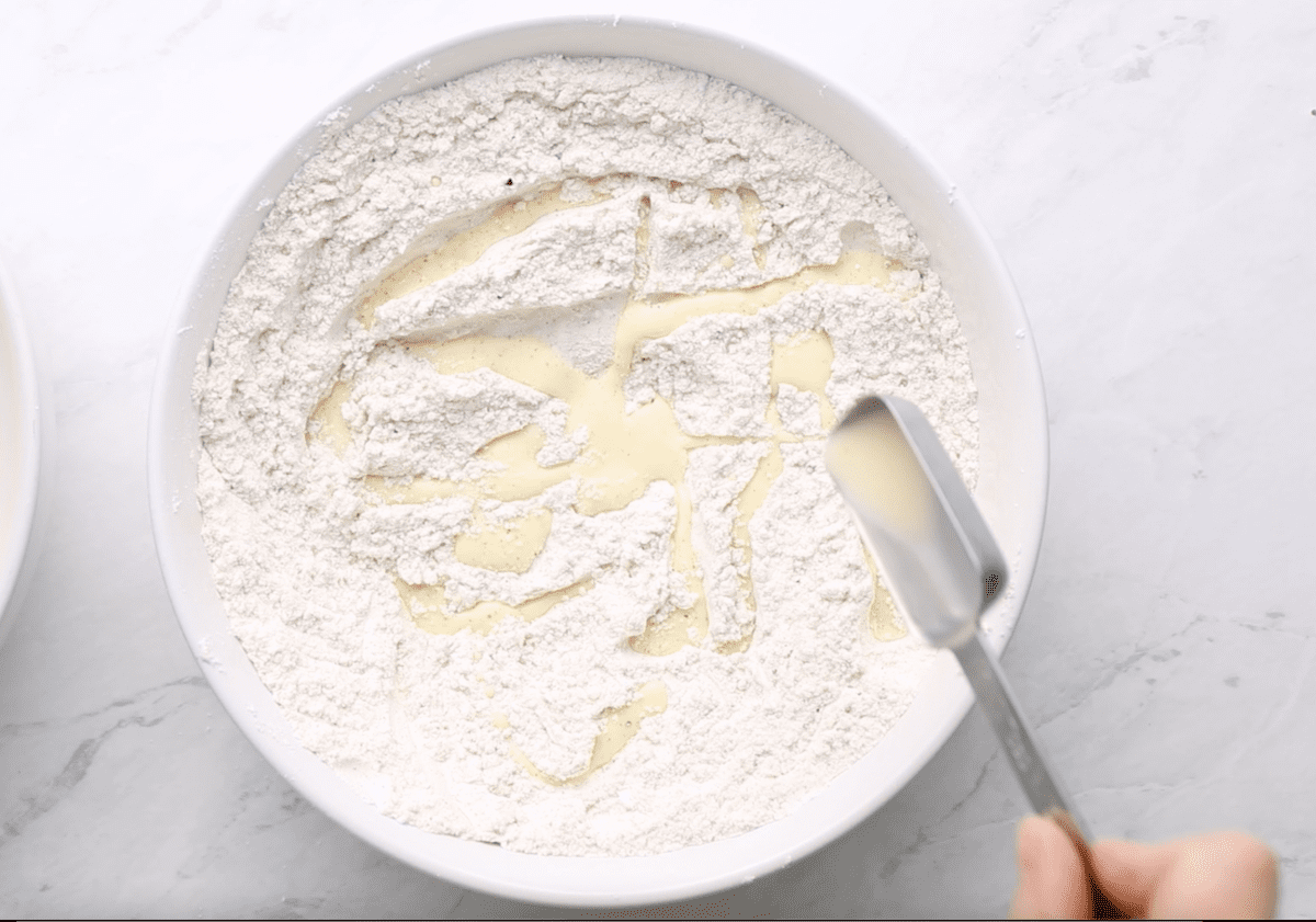 drizzling egg mixture into dry ingredients