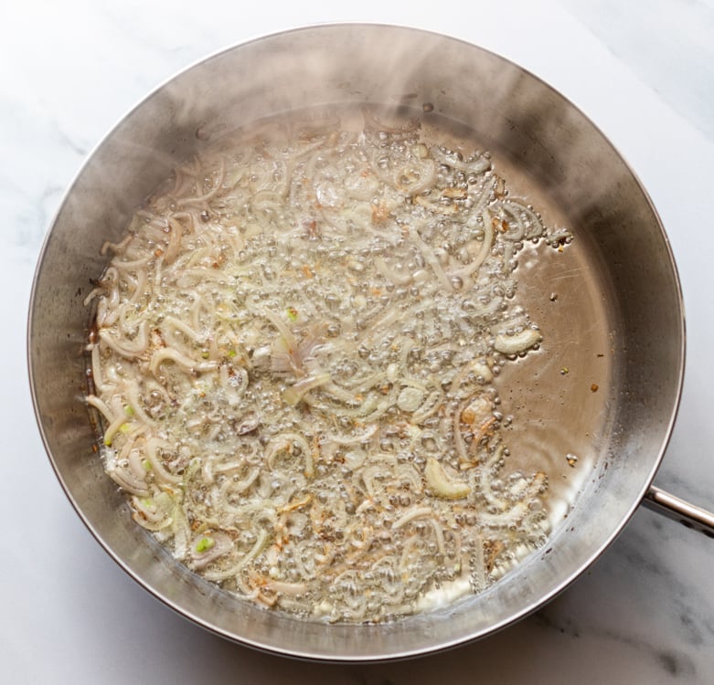 shallots cooking in skillet for shrimp scampi