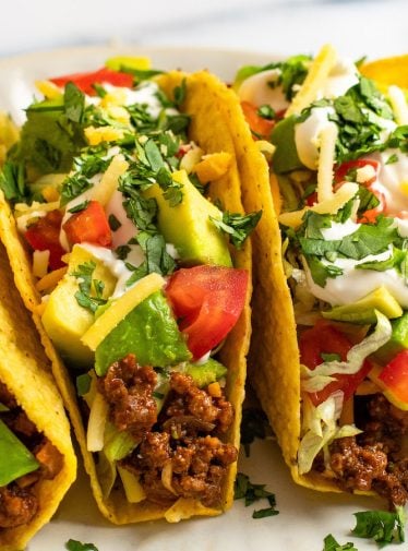 beef tacos with all the fixings on plate