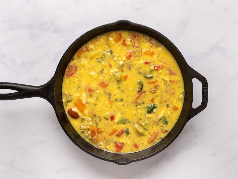vegetable, cheese, and egg mixture in the skillet