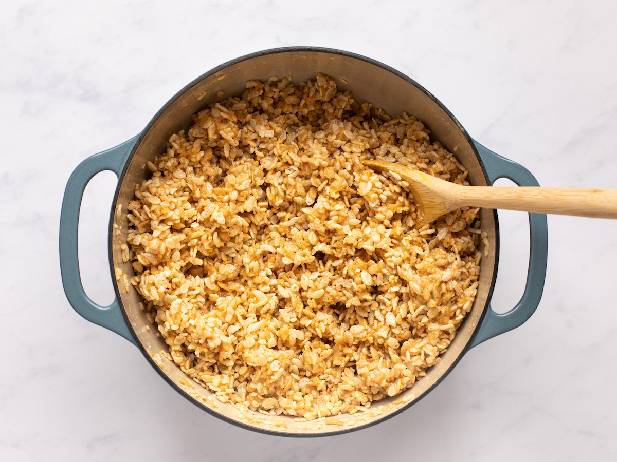 stirring cereal into marshmallow mixture