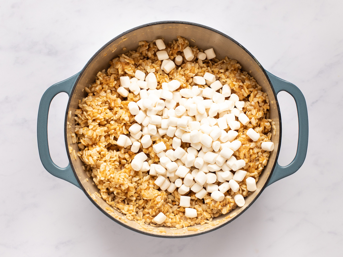 adding reserved marshmallows to dutch oven