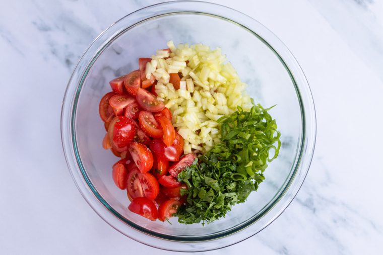 parsley, tomatoes, cucumber, scallions, salt, oil, and lemon juice in medium bowl