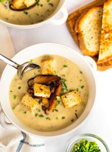 bowls of mushroom soup with bread