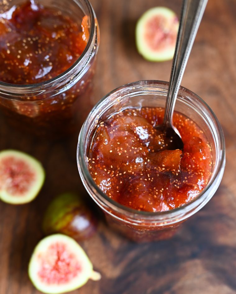 Spoon in a jar of fig jam.