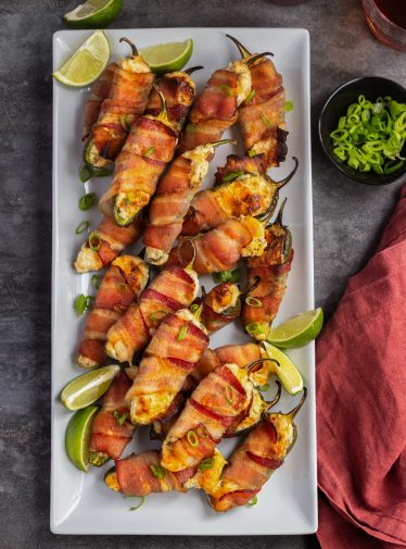 jalapeno poppers on platter with drinks