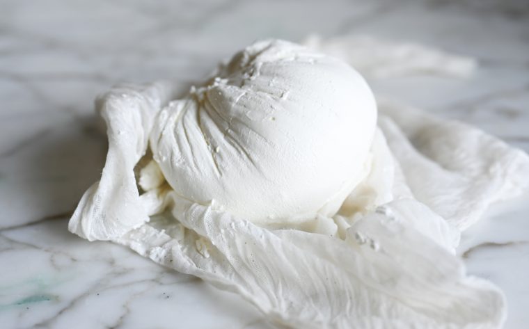 labneh unwrapped sitting on cheesecloth