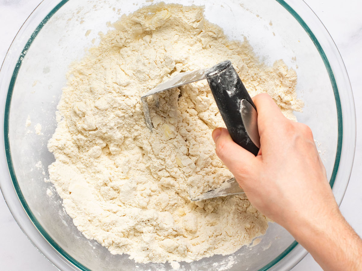 pastry cutter cutting butter into dry ingredients